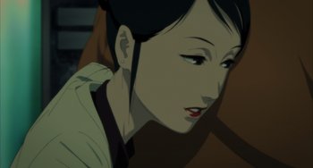 Movie still from “Paprika” (2006), directed by Satoshi Kon – An animated picture of an asian woman with dark hair and red lipstick; Close Up shot, Low angle