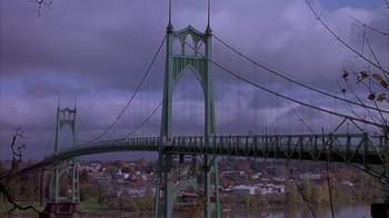 Movie still from “Paranoid Park” (2007), directed by Gus Van Sant – A view of a suspension bridge over a body of water; Extreme Wide shot, High angle