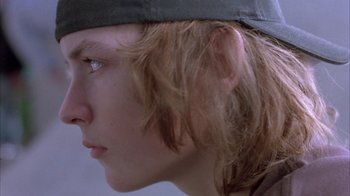 Movie still from “Paranoid Park” (2007), directed by Gus Van Sant – A person wearing a hat; Close Up shot, Low angle