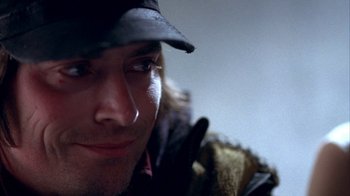 Movie still from “Paranoid Park” (2007), directed by Gus Van Sant – A person wearing a hat; Close Up shot, Over the shoulder angle