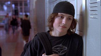 Movie still from “Paranoid Park” (2007), directed by Gus Van Sant – A young man wearing a hat and a black shirt; Close Up shot, Low angle