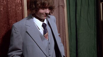 Movie still from “Paranoid Park” (2007), directed by Gus Van Sant – A young man in a suit and a tie; Medium shot, Low angle