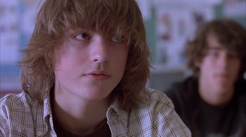 Movie still from “Paranoid Park” (2007), directed by Gus Van Sant – A person with long hair; Close Up shot, Low angle