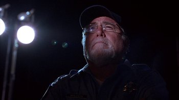 Movie still from “Paranoid Park” (2007), directed by Gus Van Sant – A person wearing glasses and a hat; Close Up shot, Low angle