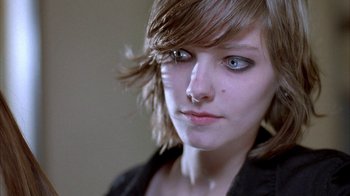 Movie still from “Paranoid Park” (2007), directed by Gus Van Sant – A woman's face with blue eyes; Close Up shot, Over the shoulder angle