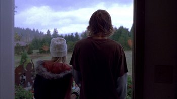 Movie still from “Paranoid Park” (2007), directed by Gus Van Sant – A man and a woman looking out of a window; Medium shot, Low angle
