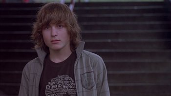 Movie still from “Paranoid Park” (2007), directed by Gus Van Sant – A young man standing in front of a staircase; Close Up shot, Low angle