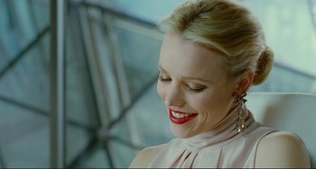 Movie still from “Passion” (2012), directed by Brian De Palma – A person wearing a dress; Close Up shot, Over the shoulder angle