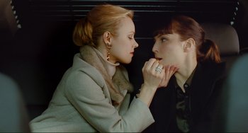 Movie still from “Passion” (2012), directed by Brian De Palma – A woman looking at her reflection in a mirror; Close Up shot, Overhead angle