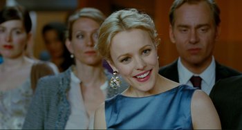Movie still from “Passion” (2012), directed by Brian De Palma – A person wearing a blue dress; Close Up shot, Over the shoulder angle