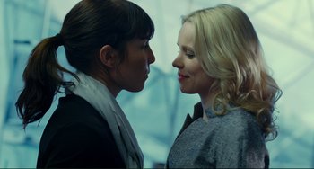 Movie still from “Passion” (2012), directed by Brian De Palma – Two women face to face in a room; Close Up shot, Over the shoulder angle