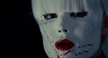 Movie still from “Passion” (2012), directed by Brian De Palma – A person's face with blood on their face; Extreme Close Up shot, Overhead angle