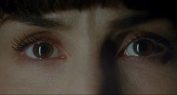 Movie still from “Passion” (2012), directed by Brian De Palma – View of the eyes of a person; Extreme Close Up shot, Overhead angle