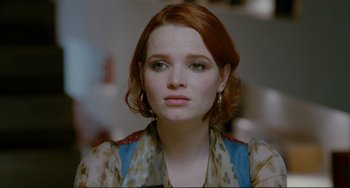 Movie still from “Passion” (2012), directed by Brian De Palma – A person with red hair; Close Up shot, Over the shoulder angle