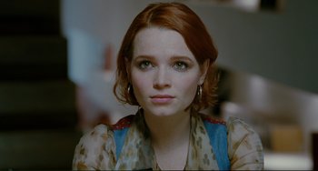 Movie still from “Passion” (2012), directed by Brian De Palma – A person with red hair; Close Up shot, Over the shoulder angle