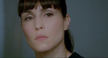 Movie still from “Passion” (2012), directed by Brian De Palma – A woman's face with brown eyes; Close Up shot, Over the shoulder angle