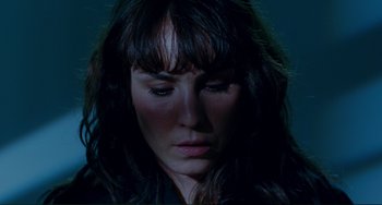 Movie still from “Passion” (2012), directed by Brian De Palma – A person with long black hair; Close Up shot, High angle
