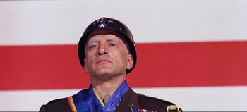 Movie still from “Patton” (1970), directed by Franklin J. Schaffner – A man in a military uniform wearing a hat; Close Up shot, Low angle