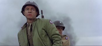 Movie still from “Patton” (1970), directed by Franklin J. Schaffner – Two men in military uniforms are standing in the fog; Medium shot, Over the shoulder angle