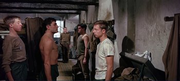 Movie still from “Patton” (1970), directed by Franklin J. Schaffner – A group of men standing next to each other in a room; Medium shot, Over the shoulder angle