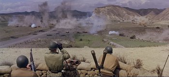 Movie still from “Patton” (1970), directed by Franklin J. Schaffner – Two men are sitting on top of a hill; Extreme Wide shot, High angle