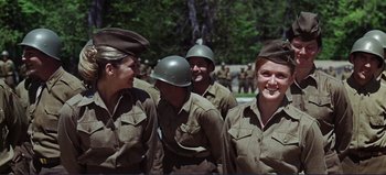 Movie still from “Patton” (1970), directed by Franklin J. Schaffner – A group of people in military uniforms standing next to each other; Medium shot, Low angle