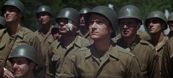 Movie still from “Patton” (1970), directed by Franklin J. Schaffner – A group of men in military uniforms standing next to each other; Close Up shot, Low angle