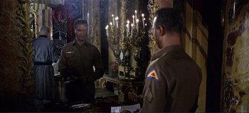 Movie still from “Patton” (1970), directed by Franklin J. Schaffner – Two men standing next to each other in front of a mirror; Medium shot, Over the shoulder angle