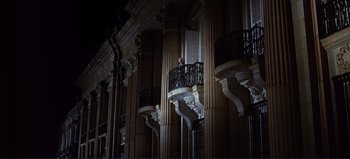 Movie still from “Patton” (1970), directed by Franklin J. Schaffner – A man standing on a balcony of a large building; Extreme Wide shot, Low angle