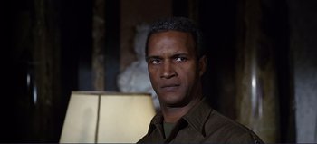 Movie still from “Patton” (1970), directed by Franklin J. Schaffner – A person wearing a brown shirt; Close Up shot, Low angle