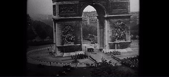 Movie still from “Patton” (1970), directed by Franklin J. Schaffner – A black and white photo of a triumphal arch; Extreme Wide shot, High angle