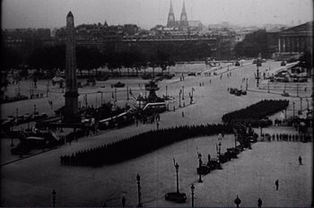 Movie still from “Patton” (1970), directed by Franklin J. Schaffner – A black and white photo of a city street; Extreme Wide shot, High angle