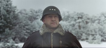 Movie still from “Patton” (1970), directed by Franklin J. Schaffner – A man wearing a helmet and a leather jacket; Close Up shot, Low angle
