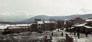 Movie still from “Patton” (1970), directed by Franklin J. Schaffner – Two people are standing in the middle of a snowy field; Extreme Wide shot, High angle