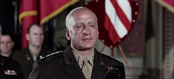 Movie still from “Patton” (1970), directed by Franklin J. Schaffner – A person wearing a military uniform; Close Up shot, Low angle