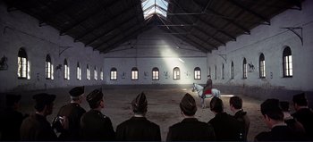 Movie still from “Patton” (1970), directed by Franklin J. Schaffner – A group of men in uniforms riding horses; Extreme Wide shot, High angle