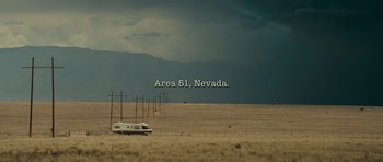Movie still from “Paul” (2011), directed by Greg Mottola – An rv is parked in the middle of an empty field; Extreme Wide shot, High angle