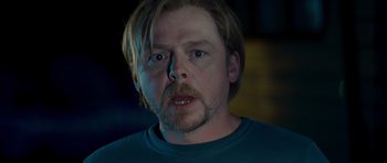 Movie still from “Paul” (2011), directed by Greg Mottola – A person wearing a blue shirt; Close Up shot, Over the shoulder angle