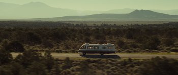 Movie still from “Paul” (2011), directed by Greg Mottola – An rv traveling down a road in the middle of the desert; Extreme Wide shot, High angle