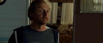 Movie still from “Paul” (2011), directed by Greg Mottola – A person with long blonde hair; Close Up shot, Over the shoulder angle