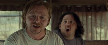 Movie still from “Paul” (2011), directed by Greg Mottola – Two men are standing in front of each other; Close Up shot, Over the shoulder angle