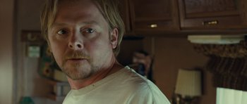 Movie still from “Paul” (2011), directed by Greg Mottola – A person wearing a white shirt; Close Up shot, Over the shoulder angle