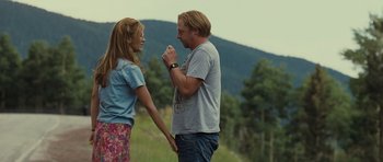 Movie still from “Paul” (2011), directed by Greg Mottola – A man and a woman standing next to each other; Medium shot, Over the shoulder angle