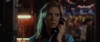 Movie still from “Paul” (2011), directed by Greg Mottola – A woman holding a phone up to her ear; Close Up shot, Over the shoulder angle