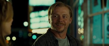 Movie still from “Paul” (2011), directed by Greg Mottola – A person smiling for the camera; Close Up shot, Over the shoulder angle