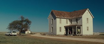 Movie still from “Paul” (2011), directed by Greg Mottola – An old farm house in the middle of a field; Extreme Wide shot, Low angle