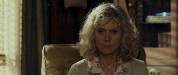 Movie still from “Paul” (2011), directed by Greg Mottola – A person sitting in a chair; Close Up shot, Over the shoulder angle