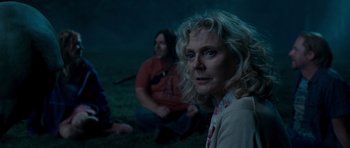 Movie still from “Paul” (2011), directed by Greg Mottola – Two people sitting on the ground in the dark; Medium shot, Over the shoulder angle