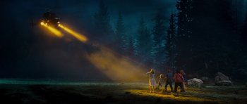 Movie still from “Paul” (2011), directed by Greg Mottola – A group of people standing in a field at night; Extreme Wide shot, Low angle
