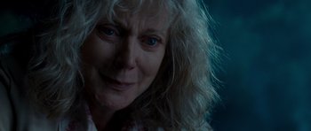 Movie still from “Paul” (2011), directed by Greg Mottola – An older woman with long white hair and blue eyes; Close Up shot, Over the shoulder angle